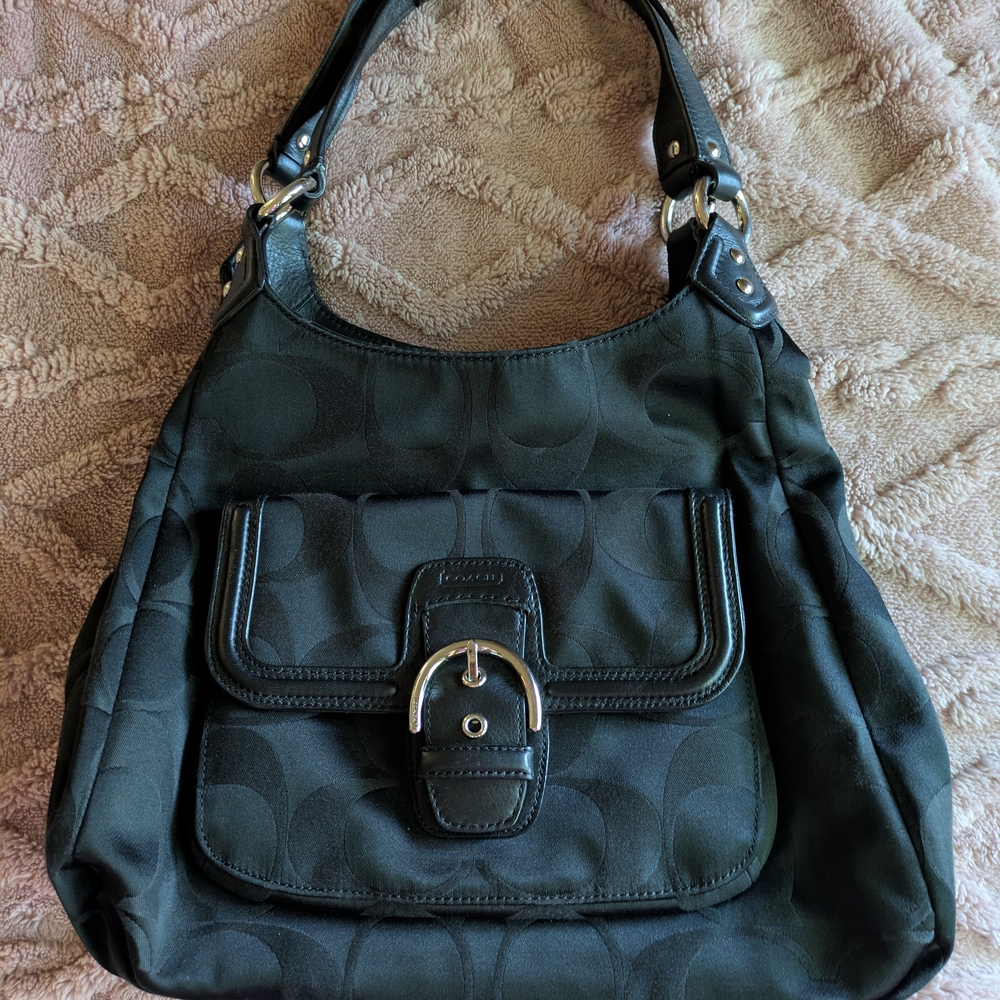 Black Coach Shoulder Bag with Structured Design and Adjustable Straps